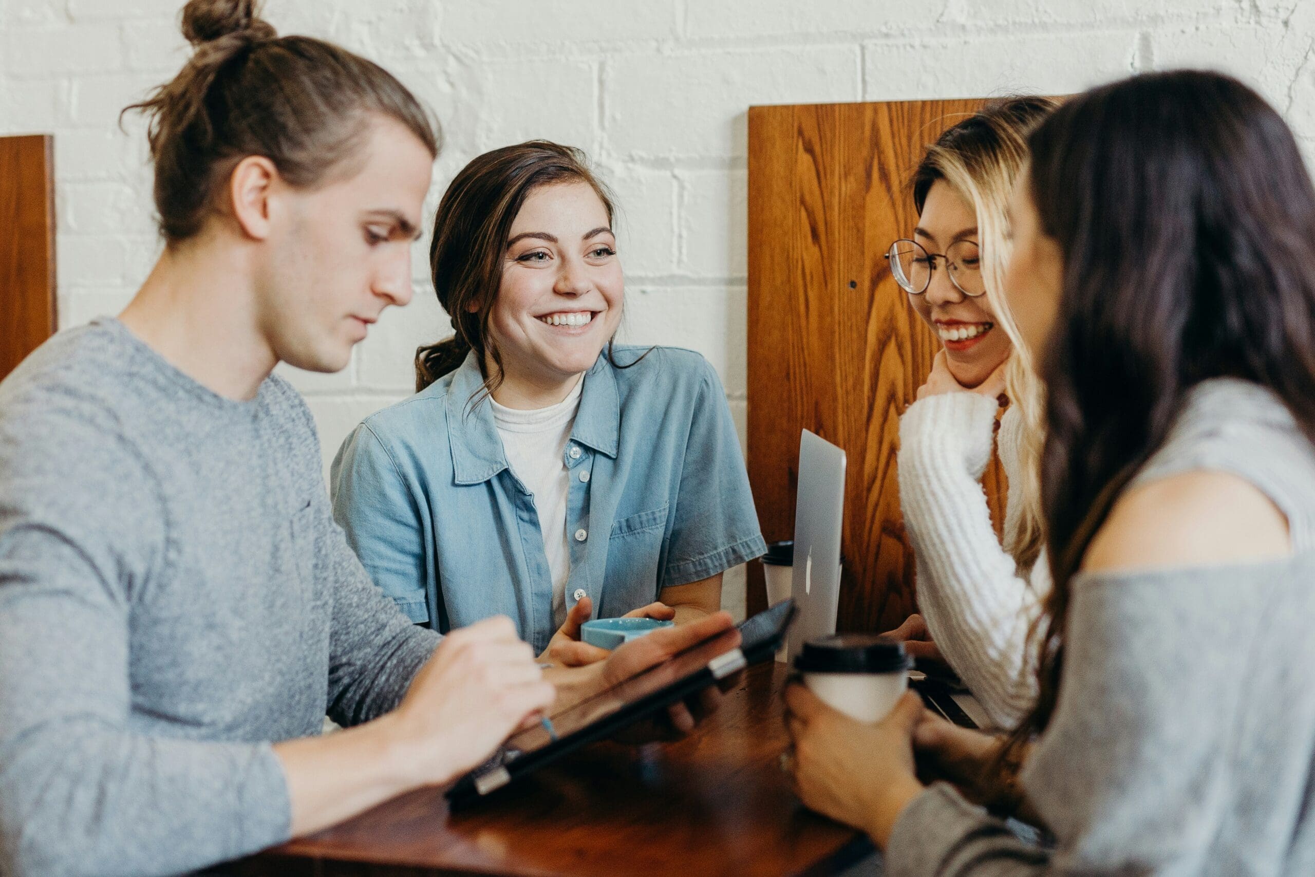 HR solutions/HR Consulting Services for small businesses: Diverse team collaborating on HR strategies in a modern office, reflecting The People Biz's inclusive approach