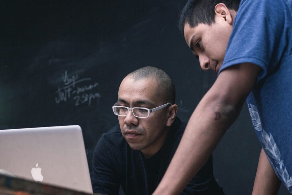 Man working on a computer, reviewing worker classification rules for W-2 and 1099 contractors as outlined in the Department of Labor’s new guidelines.